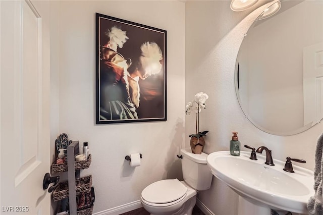 8121 Russell Creek Ct, Las Vegas, NV 89139 - bathroom with a sink, baseboards, and toilet