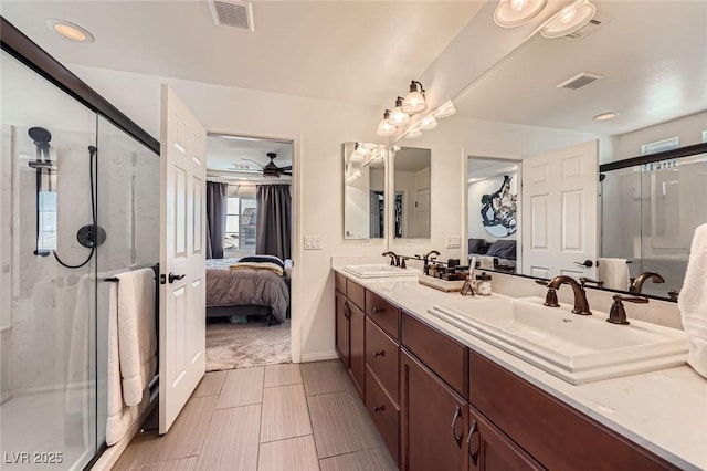 8121 Russell Creek Ct, Las Vegas, NV 89139 - ensuite bathroom featuring double vanity, a stall shower, and ceiling fan