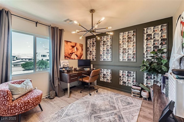 8121 Russell Creek Ct, Las Vegas, NV 89139 - home office with a chandelier, plenty of natural light, and wood finished floors