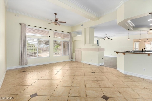 6779 Rainstorm Ridge Ave, Las Vegas, NV 89131 - unfurnished living room with a ceiling fan, healthy amount of natural light, ornamental molding, and light tile patterned flooring