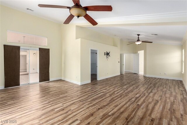 6779 Rainstorm Ridge Ave, Las Vegas, NV 89131 - unfurnished living room featuring a ceiling fan, wood finished floors, ornamental molding, and baseboards
