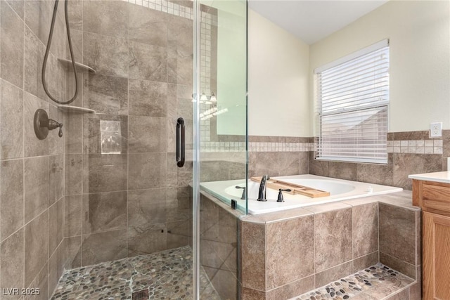 6779 Rainstorm Ridge Ave, Las Vegas, NV 89131 - bathroom featuring vanity, a garden tub, and a shower stall