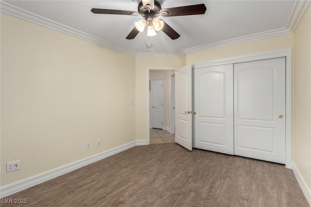 6779 Rainstorm Ridge Ave, Las Vegas, NV 89131 - unfurnished bedroom with crown molding, wood finished floors, baseboards, a closet, and ceiling fan
