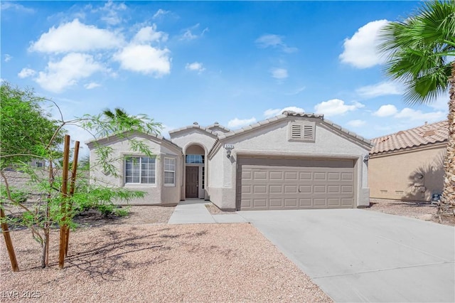 3228 Jumping Hills Ave, Henderson, NV 89052 - ranch-style house featuring stucco siding, a garage, and driveway