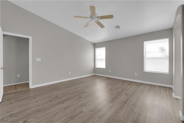 3228 Jumping Hills Ave, Henderson, NV 89052 - empty room with ceiling fan, wood finished floors, vaulted ceiling, and baseboards