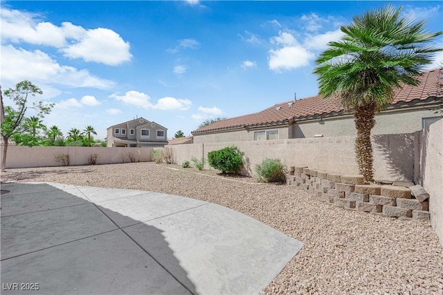 3228 Jumping Hills Ave, Henderson, NV 89052 - fenced backyard with a patio area