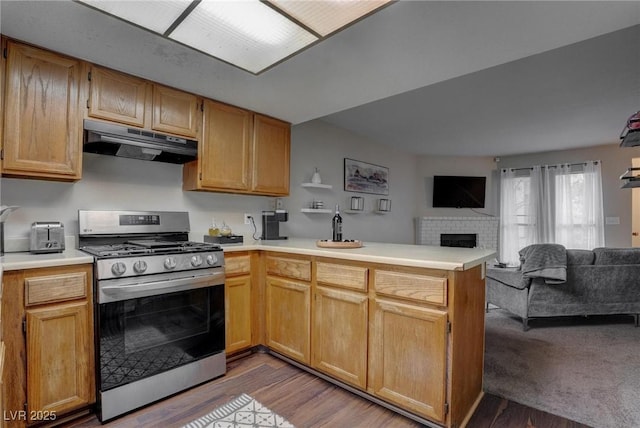 573 Sellers Pl, Henderson, NV 89011 - kitchen featuring stainless steel range with gas cooktop, under cabinet range hood, a peninsula, and open floor plan