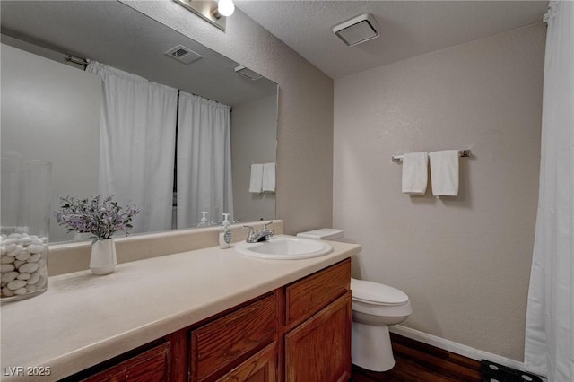 573 Sellers Pl, Henderson, NV 89011 - bathroom with toilet, vanity, wood finished floors, and baseboards