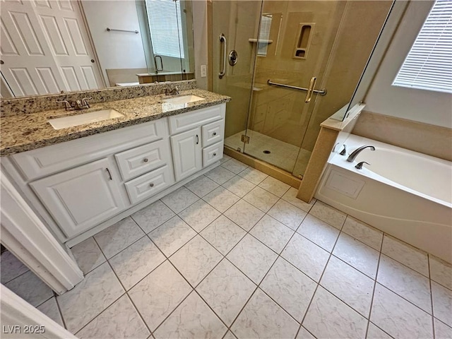 316 Lingering Ln, Henderson, NV 89012 - bathroom with a stall shower, a garden tub, double vanity, and tile patterned floors