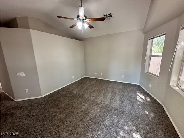 316 Lingering Ln, Henderson, NV 89012 - empty room with dark colored carpet, lofted ceiling, a ceiling fan, and baseboards