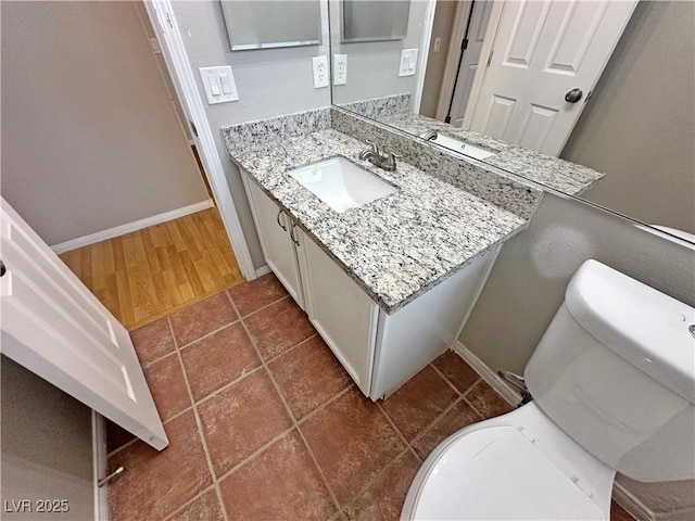 316 Lingering Ln, Henderson, NV 89012 - bathroom with vanity, baseboards, toilet, and tile patterned floors