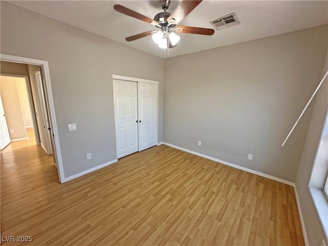 316 Lingering Ln, Henderson, NV 89012 - unfurnished bedroom with baseboards, light wood-style floors, and a closet