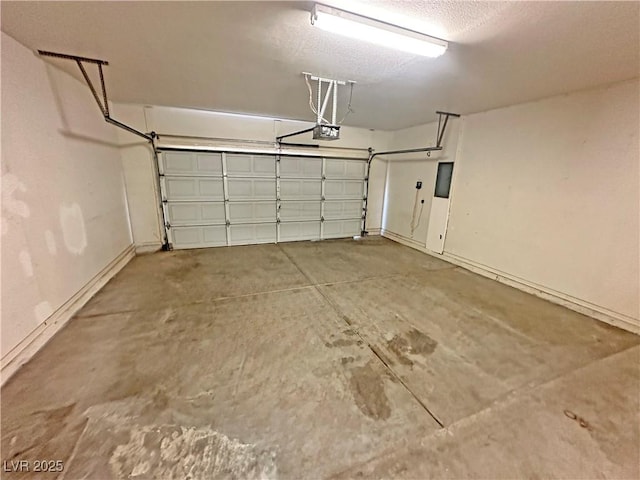 316 Lingering Ln, Henderson, NV 89012 - garage featuring a garage door opener and baseboards