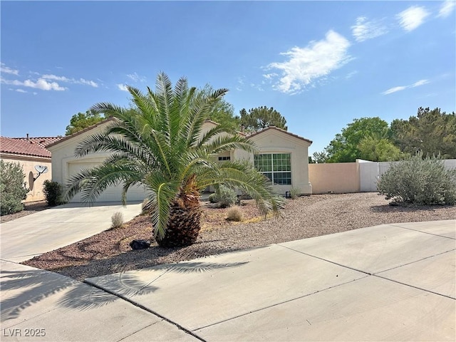 316 Lingering Ln, Henderson, NV 89012 - view of front of house featuring concrete driveway, stucco siding, a garage, and a tiled roof