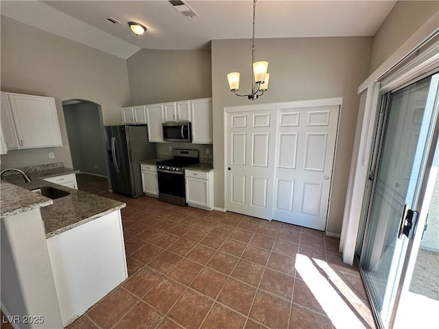 316 Lingering Ln, Henderson, NV 89012 - kitchen featuring appliances with stainless steel finishes, a sink, white cabinetry, high vaulted ceiling, and light stone countertops