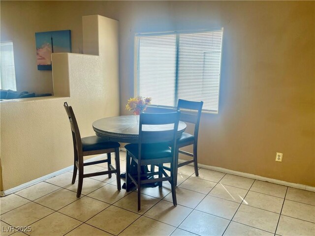 1667 Marion Bennet Dr, Las Vegas, NV 89106 - dining room with baseboards and light tile patterned floors
