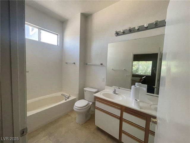 1667 Marion Bennet Dr, Las Vegas, NV 89106 - full bathroom with a bathtub, toilet, double vanity, and tile patterned flooring