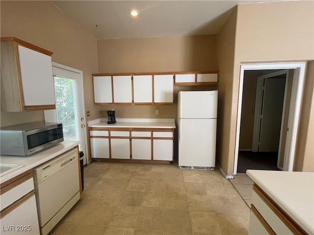 1667 Marion Bennet Dr, Las Vegas, NV 89106 - kitchen featuring white appliances, light countertops, and white cabinetry