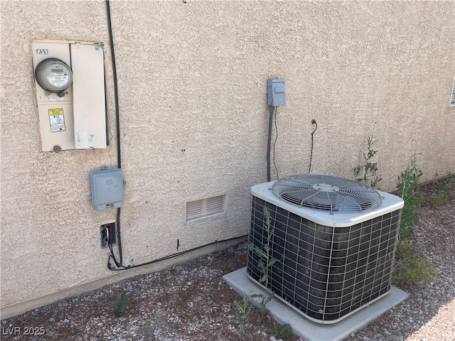 1667 Marion Bennet Dr, Las Vegas, NV 89106 - exterior view of central AC, stucco siding, and electric meter