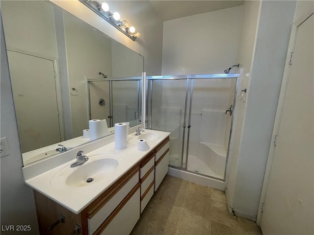 1667 Marion Bennet Dr, Las Vegas, NV 89106 - bathroom with double vanity, a shower stall, and tile patterned floors