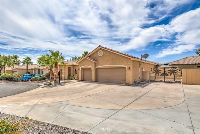 7427 Page Ranch Ct, Las Vegas, NV 89131 - mediterranean / spanish-style home featuring driveway, stucco siding, a garage, a tile roof, and a gate