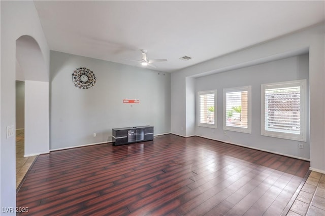7427 Page Ranch Ct, Las Vegas, NV 89131 - spare room with wood finished floors, ceiling fan, baseboards, and arched walkways