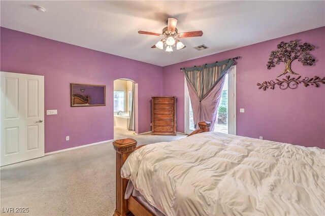 7427 Page Ranch Ct, Las Vegas, NV 89131 - carpeted bedroom featuring arched walkways, baseboards, access to exterior, ceiling fan, and ensuite bath