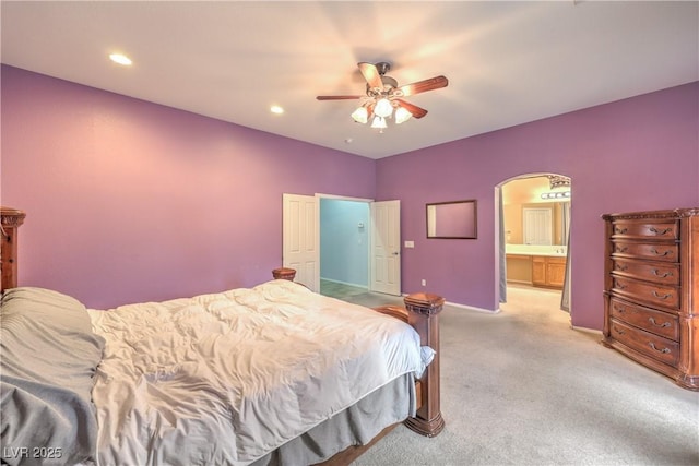 7427 Page Ranch Ct, Las Vegas, NV 89131 - bedroom with arched walkways, light carpet, baseboards, ceiling fan, and recessed lighting