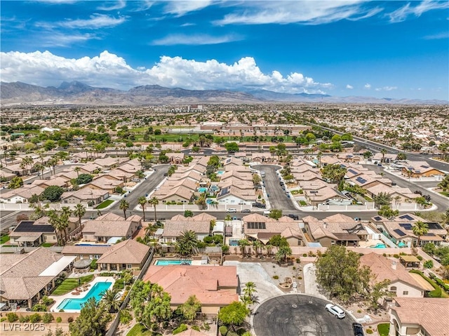 7427 Page Ranch Ct, Las Vegas, NV 89131 - aerial perspective of suburban area with a mountainous background and a pool