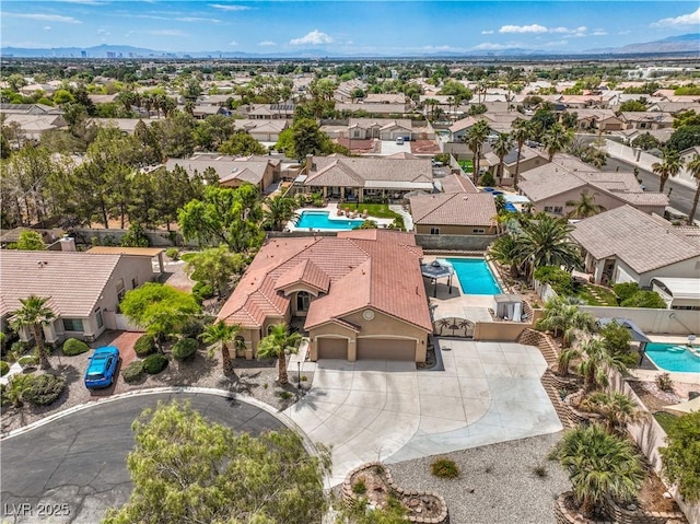 7427 Page Ranch Ct, Las Vegas, NV 89131 - aerial view of residential area featuring a pool and mountains