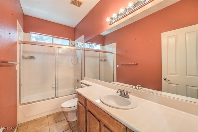 7427 Page Ranch Ct, Las Vegas, NV 89131 - bathroom with toilet, vanity, bath / shower combo with glass door, and tile patterned flooring