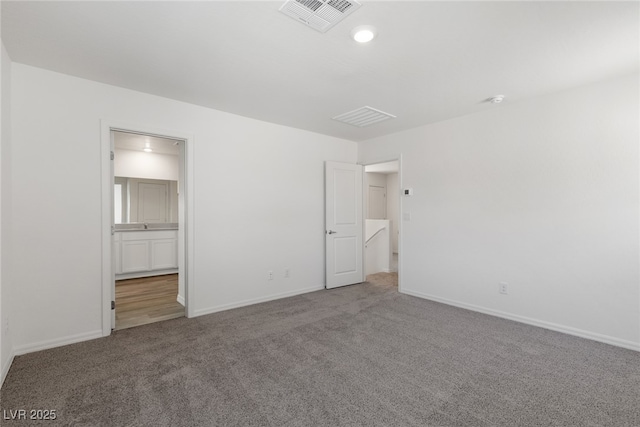 6252 Blood Lily Ave, Las Vegas, NV 89122 - unfurnished bedroom with carpet flooring, baseboards, and ensuite bath