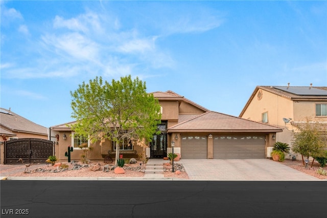 5940 Vizzi Ct, Las Vegas, NV 89131 - view of front of home featuring a garage, driveway, and stucco siding