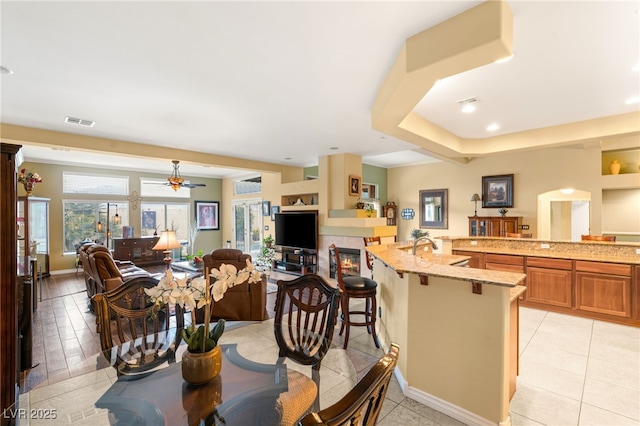 5940 Vizzi Ct, Las Vegas, NV 89131 - dining room featuring plenty of natural light, ceiling fan, and light tile patterned flooring