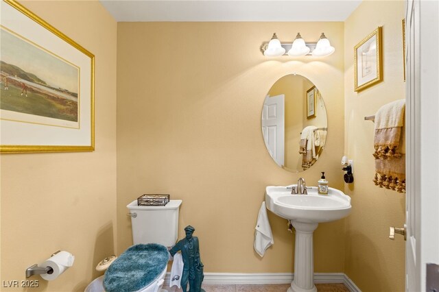 5940 Vizzi Ct, Las Vegas, NV 89131 - bathroom featuring toilet, tile patterned flooring, and baseboards