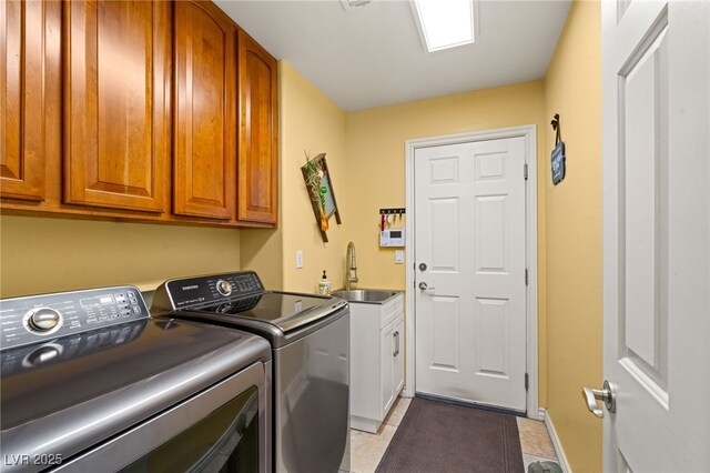 5940 Vizzi Ct, Las Vegas, NV 89131 - washroom featuring washing machine and dryer, cabinet space, baseboards, and light tile patterned flooring