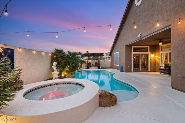 5940 Vizzi Ct, Las Vegas, NV 89131 - pool at dusk with an in-ground hot tub, a patio, a fenced backyard, and french doors