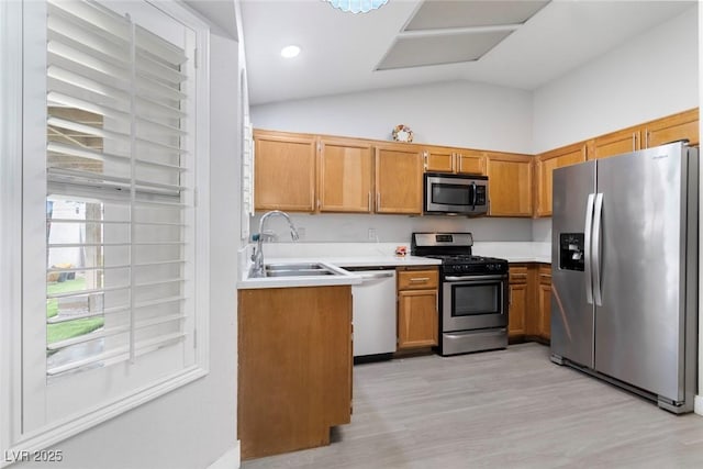 3157 Capetown Way, Las Vegas, NV 89128 - kitchen with appliances with stainless steel finishes, a sink, lofted ceiling, light countertops, and light wood-type flooring