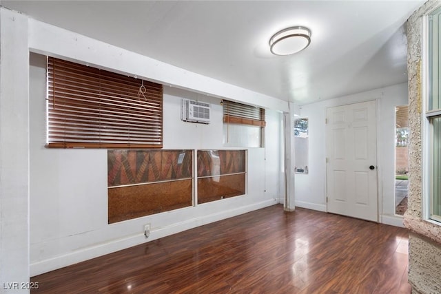 3157 Capetown Way, Las Vegas, NV 89128 - foyer entrance with a wall mounted AC, wood finished floors, and baseboards