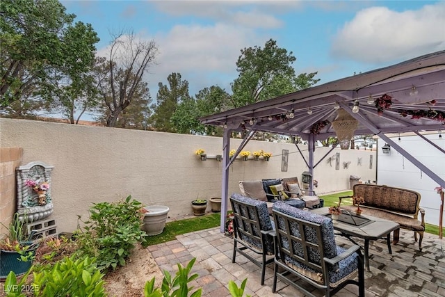 3157 Capetown Way, Las Vegas, NV 89128 - fenced backyard featuring a gazebo, an outdoor living space, and a patio