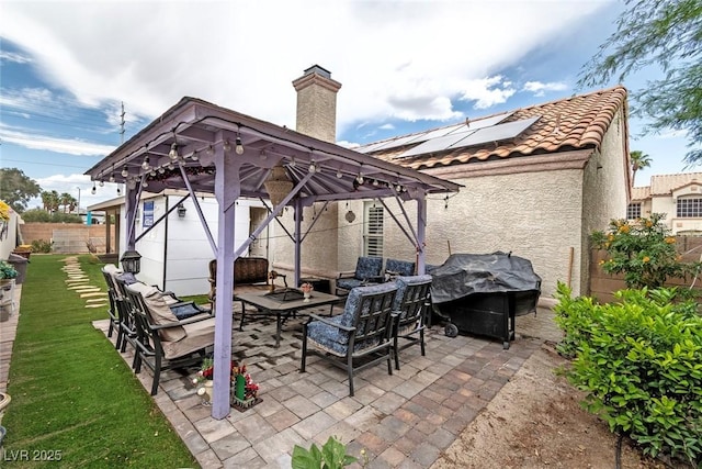 3157 Capetown Way, Las Vegas, NV 89128 - fenced backyard featuring an outdoor hangout area, a gazebo, and a patio