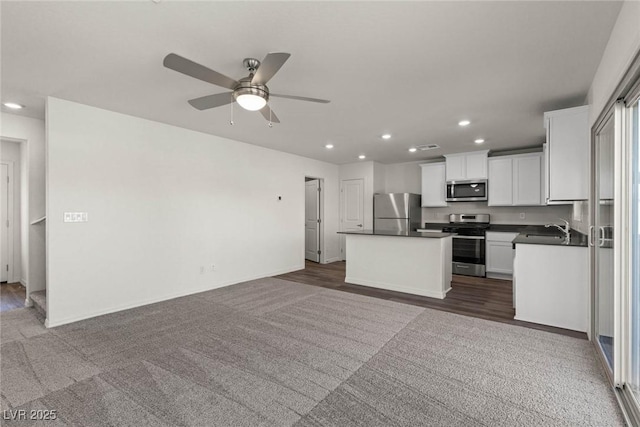 6197 Blood Lily Ave, Las Vegas, NV 89122 - kitchen featuring stainless steel appliances, dark countertops, recessed lighting, a sink, and ceiling fan