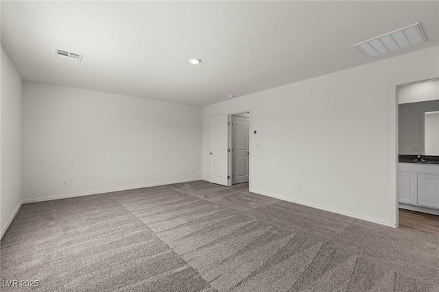 6197 Blood Lily Ave, Las Vegas, NV 89122 - carpeted spare room with a sink, baseboards, and recessed lighting