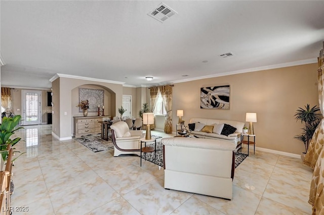 8223 Saddleback Ledge Ave, Las Vegas, NV 89147 - living room featuring crown molding, arched walkways, baseboards, and light tile patterned floors