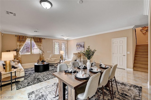 8223 Saddleback Ledge Ave, Las Vegas, NV 89147 - dining room featuring crown molding, stairway, and baseboards