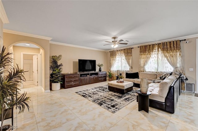 8223 Saddleback Ledge Ave, Las Vegas, NV 89147 - living area with crown molding, a ceiling fan, and arched walkways