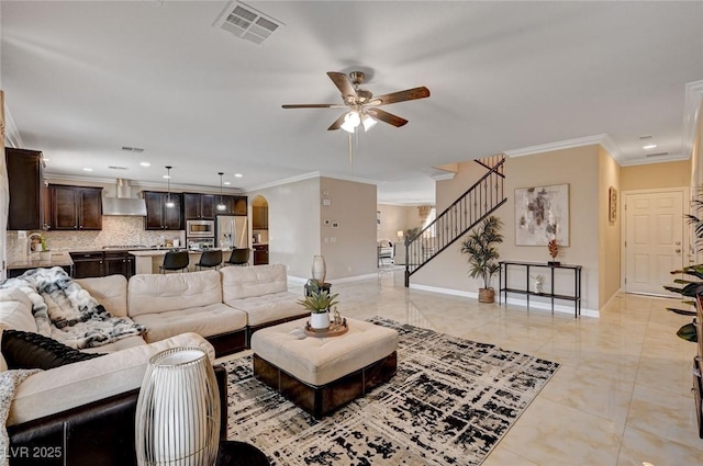 8223 Saddleback Ledge Ave, Las Vegas, NV 89147 - living area featuring a ceiling fan, crown molding, stairs, baseboards, and recessed lighting