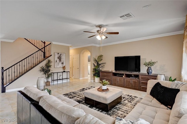 8223 Saddleback Ledge Ave, Las Vegas, NV 89147 - living area featuring stairway, arched walkways, crown molding, a ceiling fan, and light marble finish flooring