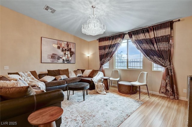 8223 Saddleback Ledge Ave, Las Vegas, NV 89147 - living area featuring a chandelier, baseboards, and wood finished floors