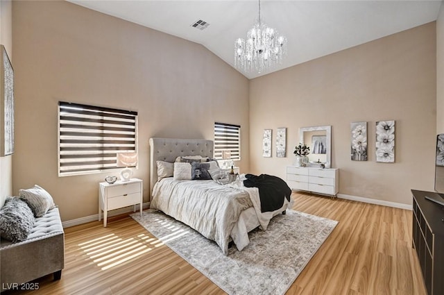 8223 Saddleback Ledge Ave, Las Vegas, NV 89147 - bedroom with a chandelier, light wood-style flooring, baseboards, and high vaulted ceiling